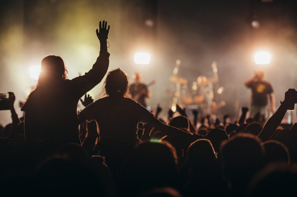 Two woman in the crowd at a music festival
