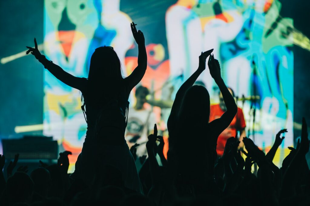 Two woman in the crowd at a music festival