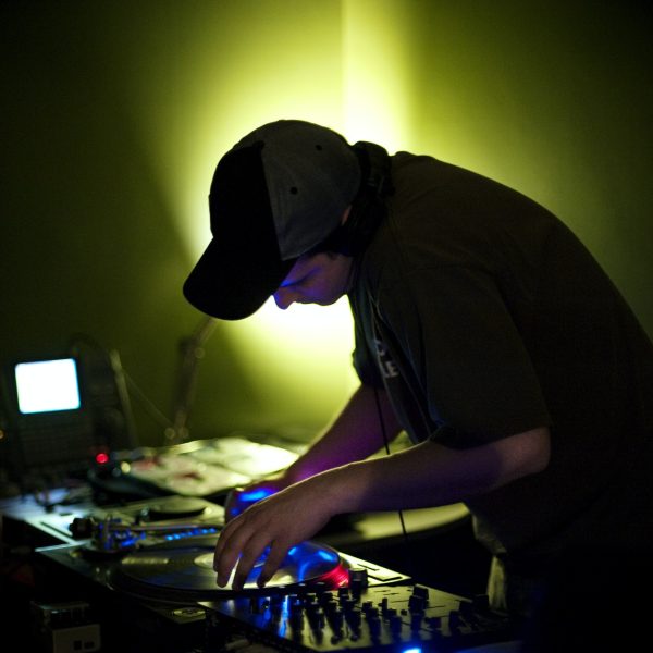 Dj Playing Music At Nightclub