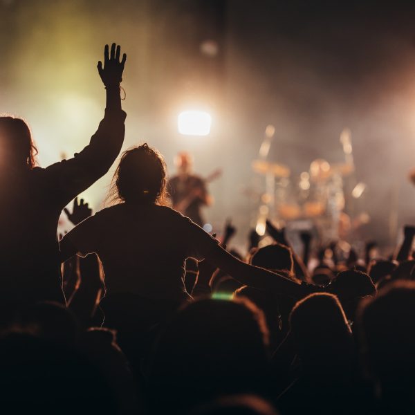 Two woman in the crowd at a music festival